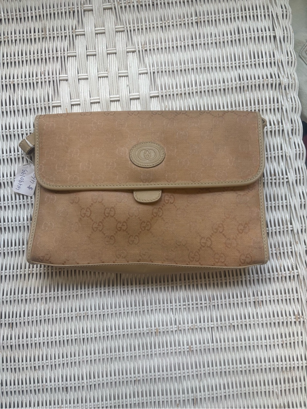 Vintage Gucci monogram fold-over clutch in warm beige-tan. Used